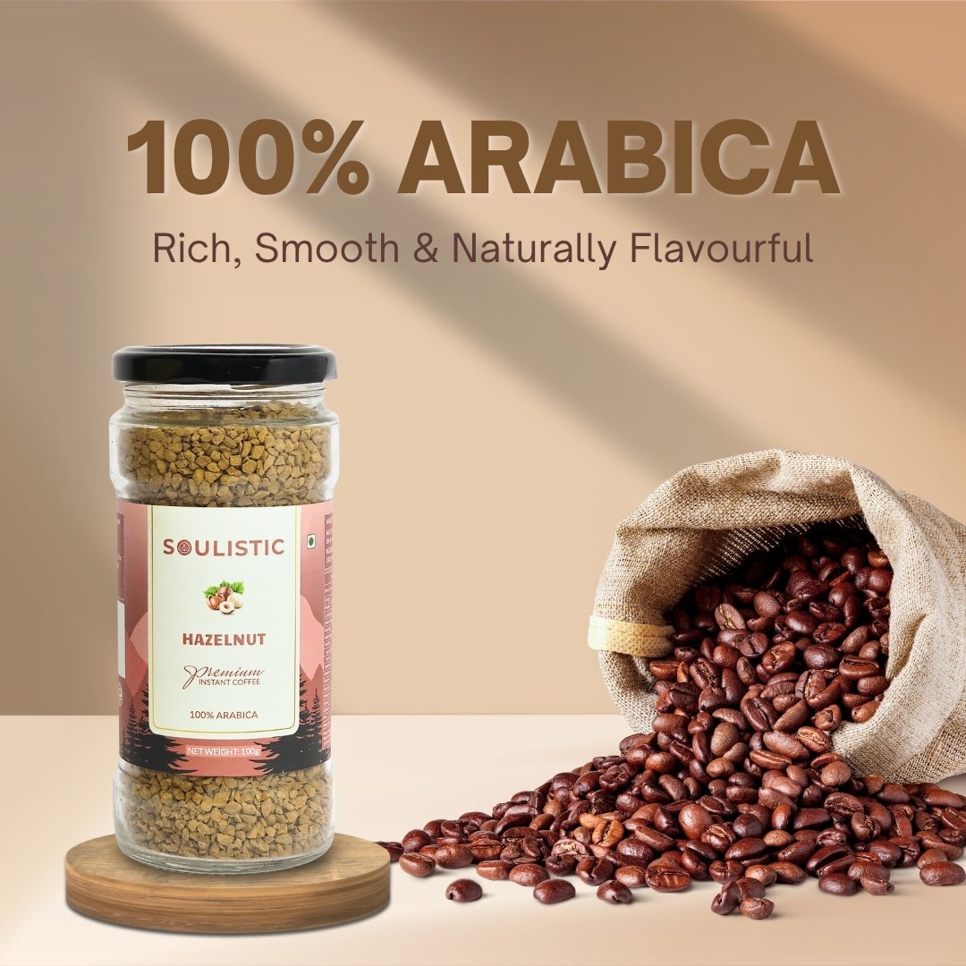 Jar of hazelnut coffee and open bag of coffee beans with '100% Arabica' text on a beige background