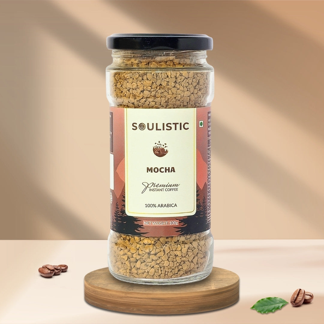 Jar of Soulistic Mocha instant coffee on a wooden stand with a beige background
