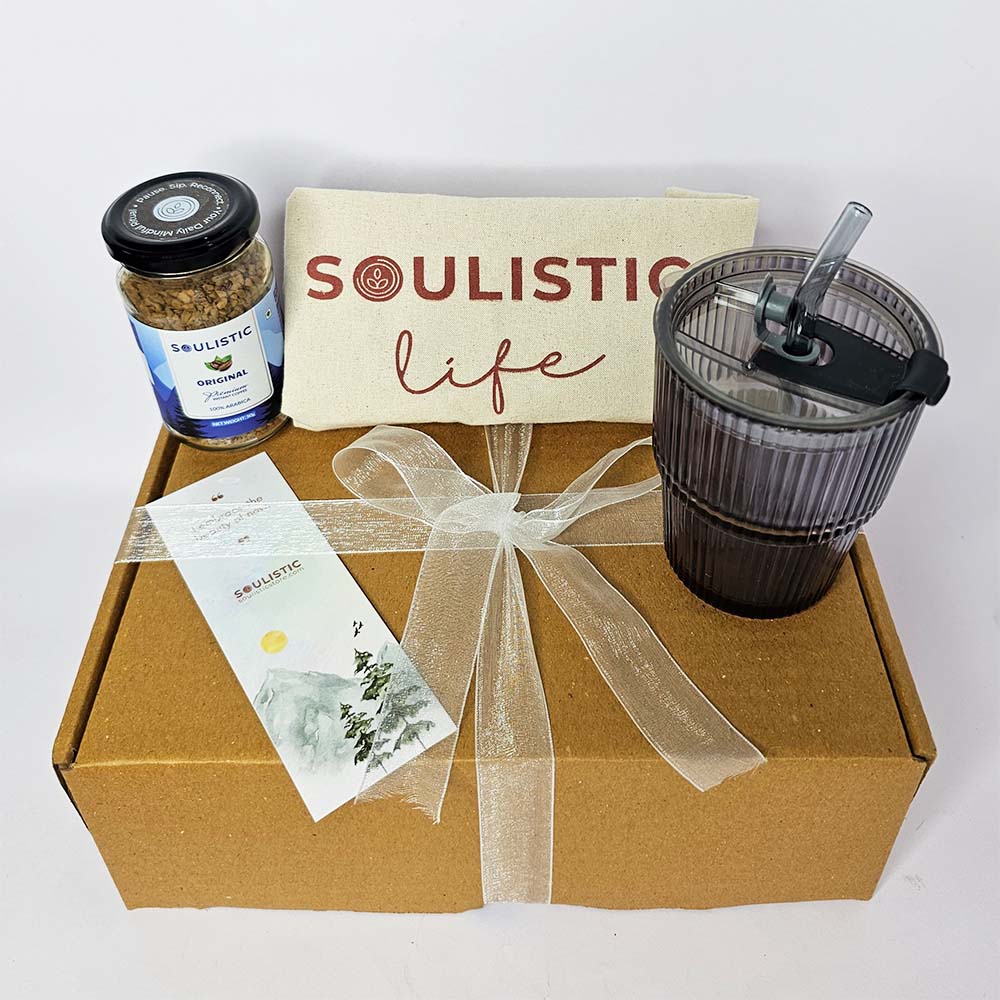 Gift box with 'Soulistic' products including a jar, mug, and packaging on a white background.