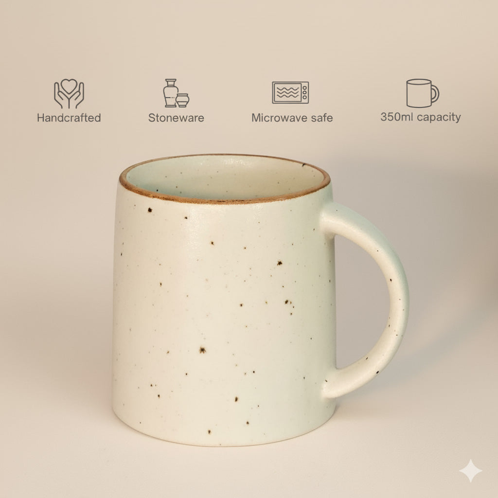 Stoneware mug with icons indicating handcrafted, stoneware, microwave safe, and 350ml capacity on a beige background.