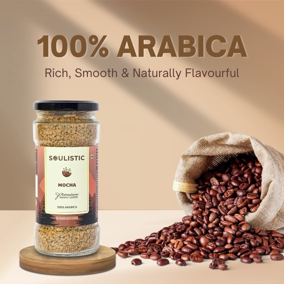 Jar of mocha coffee and open bag of coffee beans with '100% Arabica' text on a beige background