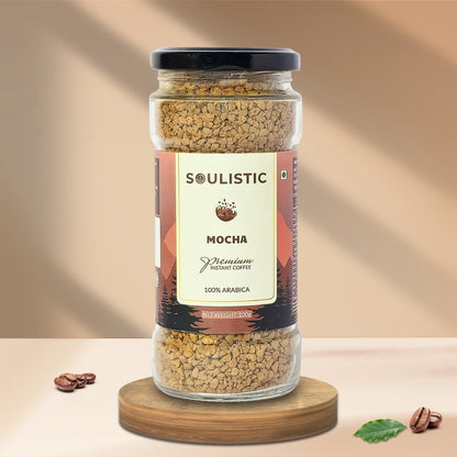 Jar of Soulistic Mocha instant coffee on a wooden stand with a beige background