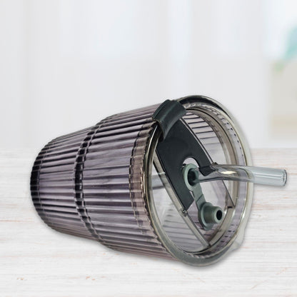 Soulistic ribbed glass sipper with a lid and straw lying on a light marble surface
