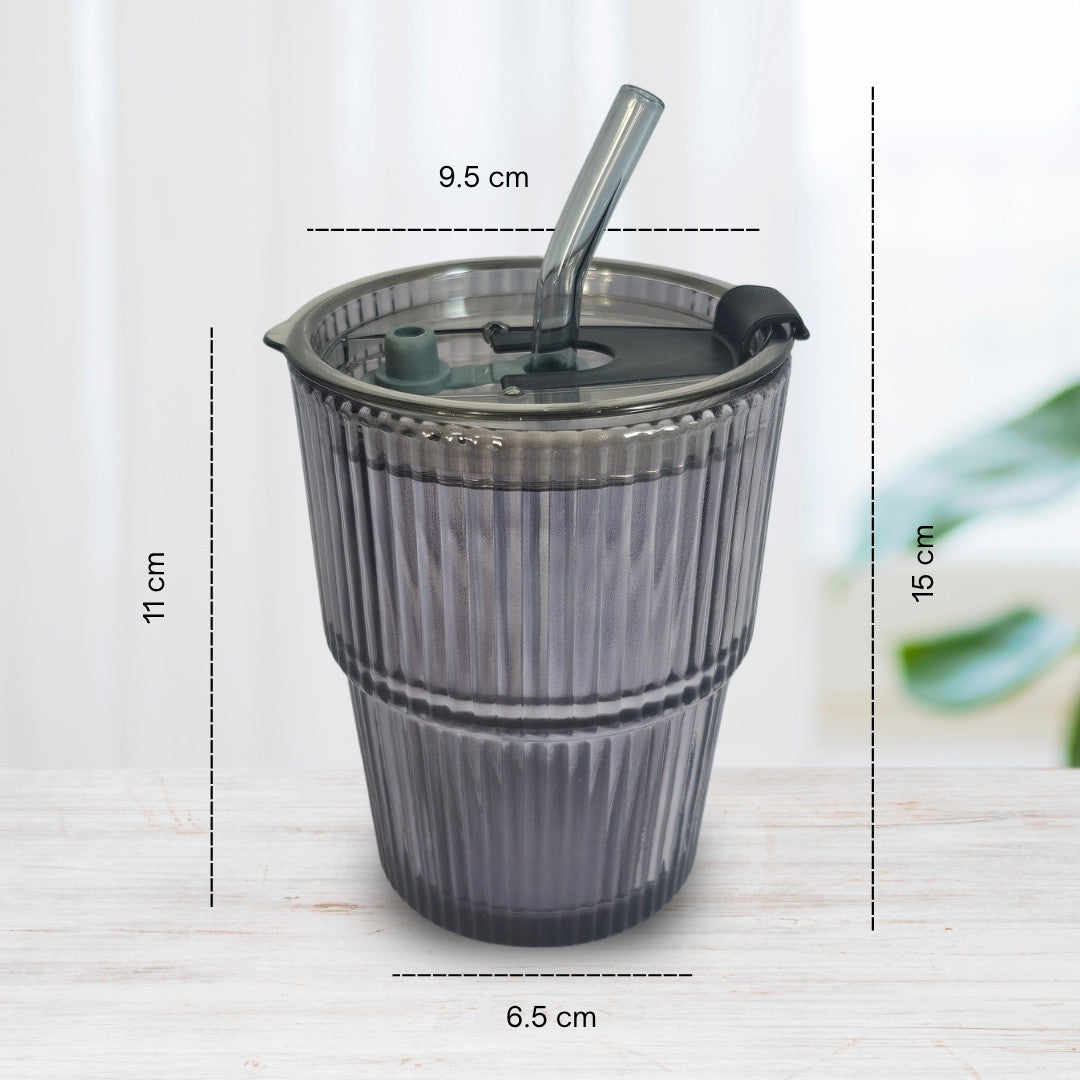 Soulistic ribbed glass sipper with lid and straw, measurements indicated, on a light marble surface.