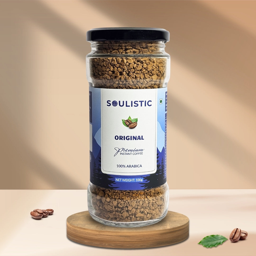 Soulistic instant coffee jar on a wooden coaster with a beige background